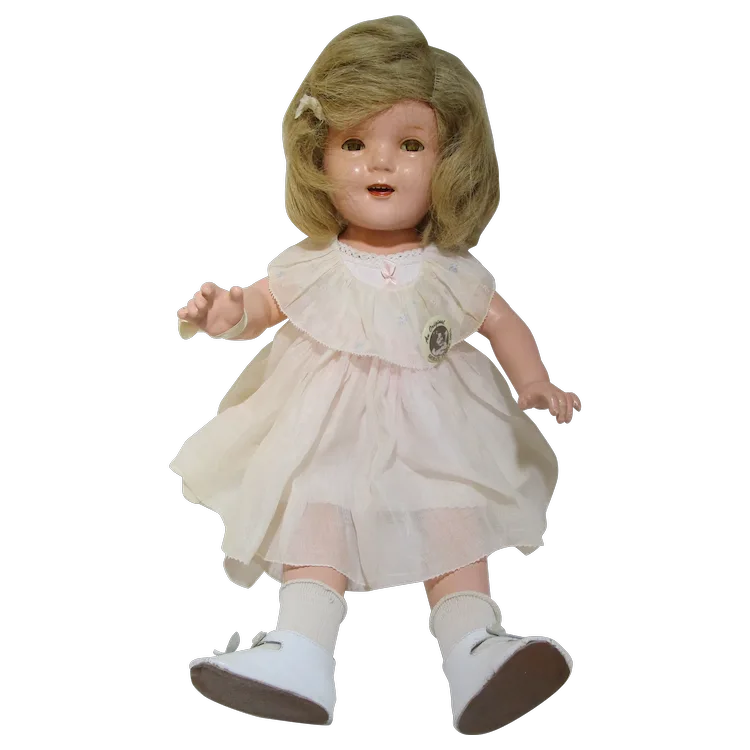 Vintage IDEAL Shirley Temple doll with original tagged dress and