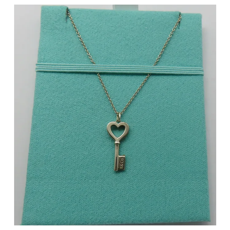 Tiffany & Co Mini Heart Key Pendant Necklace Sterling Silver. For
